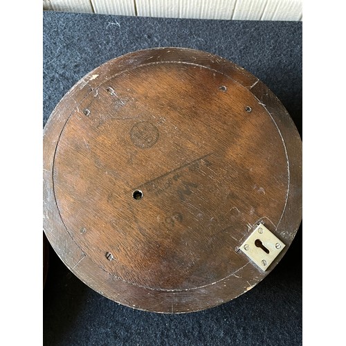 782 - Old Wood cased wall hanging Barometer with stamp to reverse Made in England to front. Diameter 9