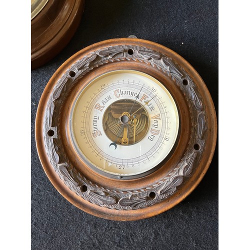 785 - Old wood cased wall hanging Barometer with open window to view workings, set in a carved plaque. num... 