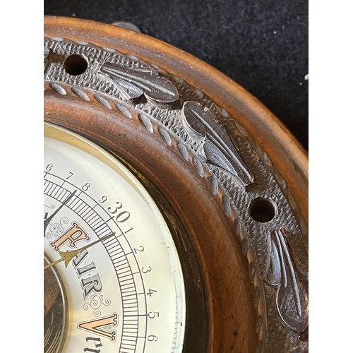 785 - Old wood cased wall hanging Barometer with open window to view workings, set in a carved plaque. num... 