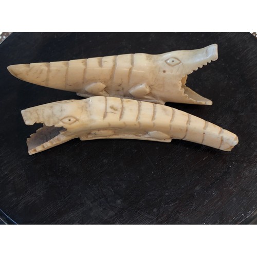 841 - Tribal Art. Pair of Crocodiles carved into teeth