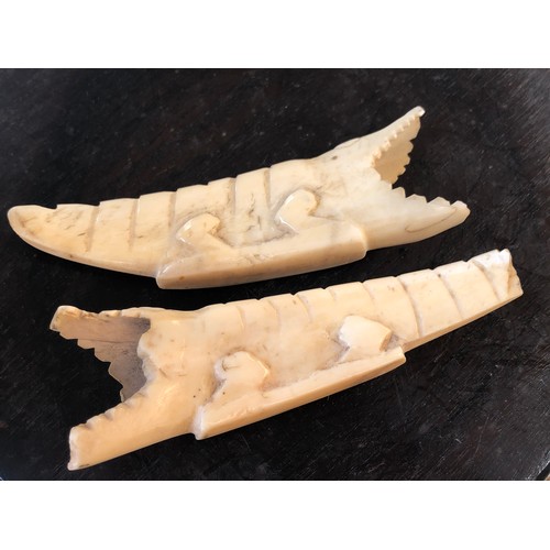 841 - Tribal Art. Pair of Crocodiles carved into teeth