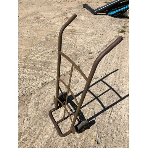 863 - Porter trolley with hard wheels. Solid in good condition