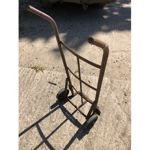 863 - Porter trolley with hard wheels. Solid in good condition