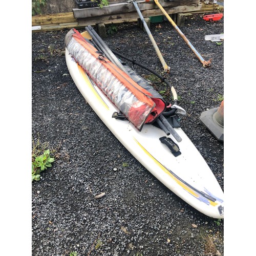 912 - F2 Windsurfing equipment. Includes board mast, 2 sails and a paddle.