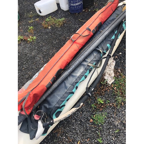 912 - F2 Windsurfing equipment. Includes board mast, 2 sails and a paddle.