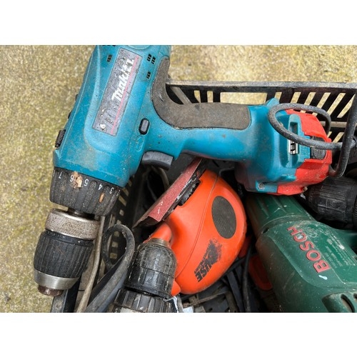 1035 - Crate of drills with lots of batteries and a hedge trimmer.