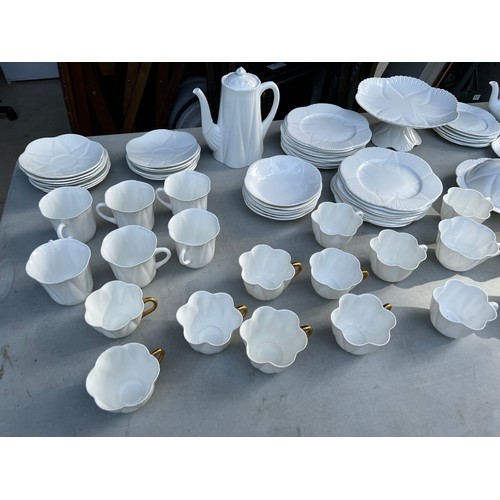 1047 - Large collection of Shelley and Wileman & co Dainty white patterned dinner and teaware.