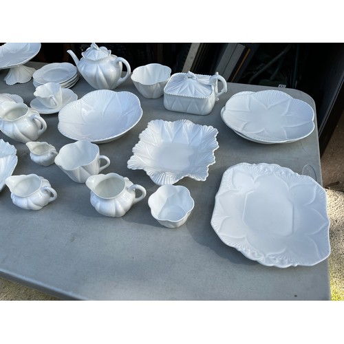 1047 - Large collection of Shelley and Wileman & co Dainty white patterned dinner and teaware.