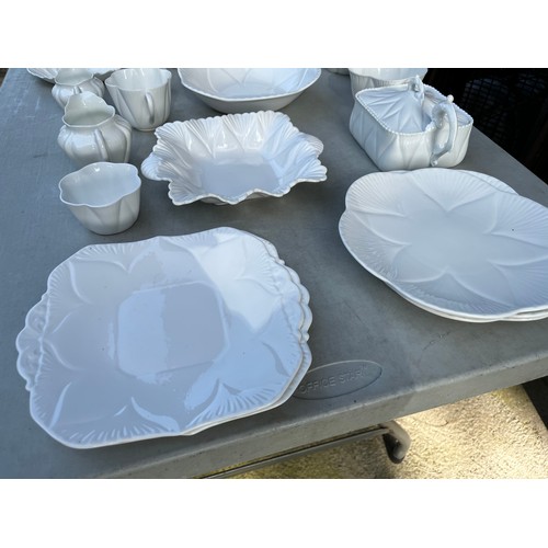 1047 - Large collection of Shelley and Wileman & co Dainty white patterned dinner and teaware.