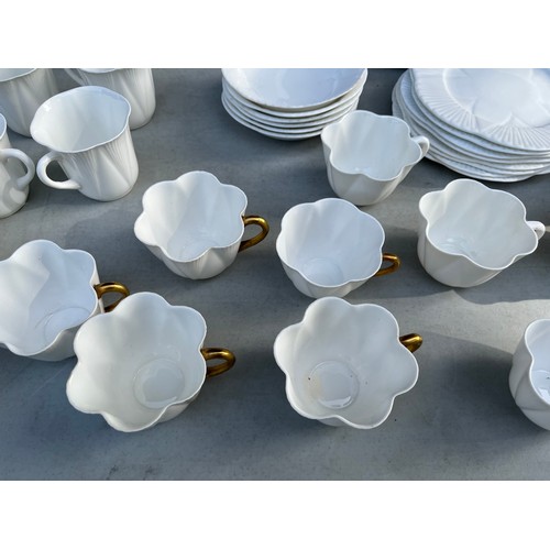 1047 - Large collection of Shelley and Wileman & co Dainty white patterned dinner and teaware.