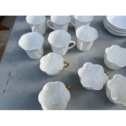 1047 - Large collection of Shelley and Wileman & co Dainty white patterned dinner and teaware.