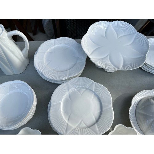 1047 - Large collection of Shelley and Wileman & co Dainty white patterned dinner and teaware.