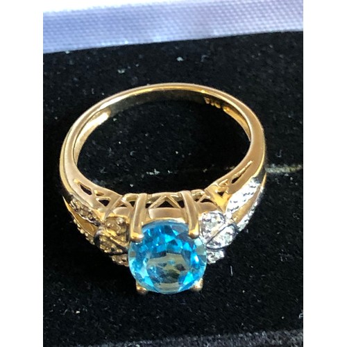 1137 - 9ct gold ring with Topaz and Diamond gallery setting. Size O 1/2