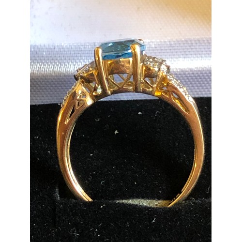 1137 - 9ct gold ring with Topaz and Diamond gallery setting. Size O 1/2