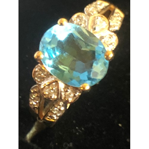 1137 - 9ct gold ring with Topaz and Diamond gallery setting. Size O 1/2