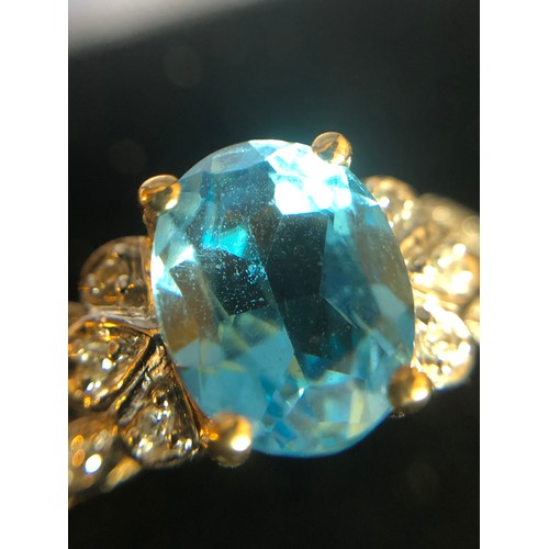 1137 - 9ct gold ring with Topaz and Diamond gallery setting. Size O 1/2