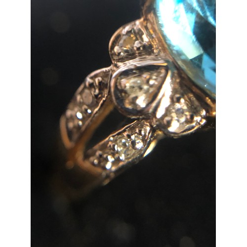 1137 - 9ct gold ring with Topaz and Diamond gallery setting. Size O 1/2