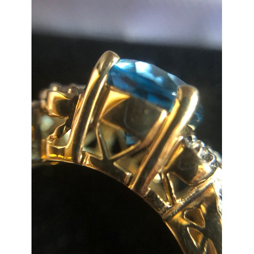 1137 - 9ct gold ring with Topaz and Diamond gallery setting. Size O 1/2