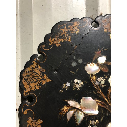 891 - Black painted oriental wall plaque inlaid with mother of pearl