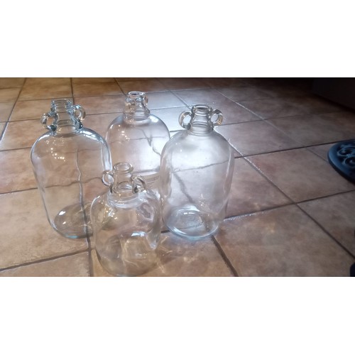 893 - 3 large an 1 small clear glass demijohn bottles for wine making.