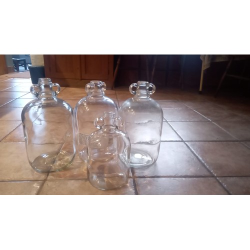 893 - 3 large an 1 small clear glass demijohn bottles for wine making.