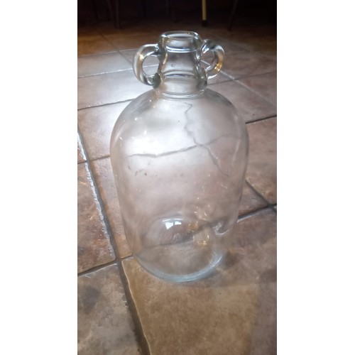 893 - 3 large an 1 small clear glass demijohn bottles for wine making.