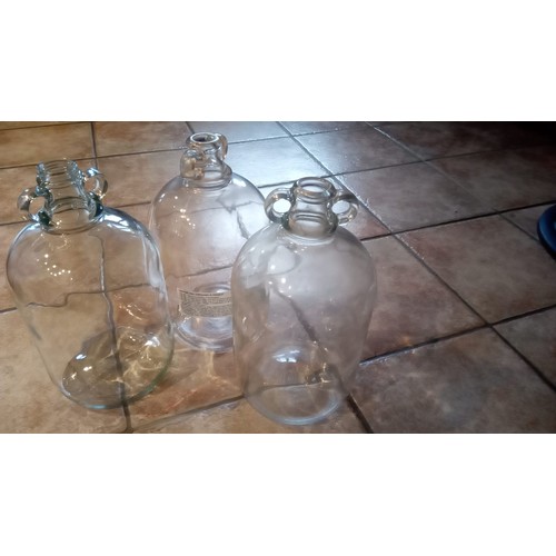 893 - 3 large an 1 small clear glass demijohn bottles for wine making.