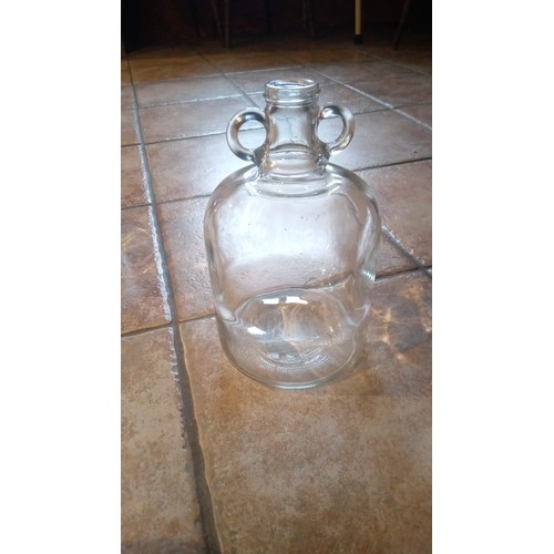 893 - 3 large an 1 small clear glass demijohn bottles for wine making.