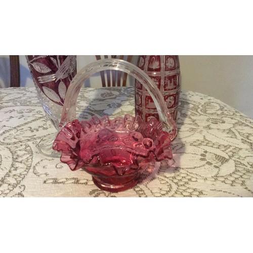 11 - Three pieces of cranberry, glass. Including brides basket, byrdes vase, And flash glass decanter wit... 