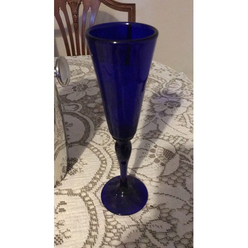 23 - Bristol, blue glass, signed, champagne, flutes And a vintage wine bottle, cooler