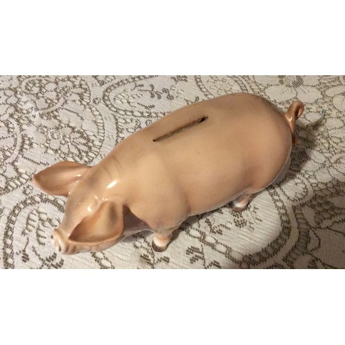 28 - Large, pottery, pig, money box, signed.