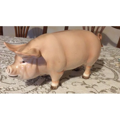 28 - Large, pottery, pig, money box, signed.