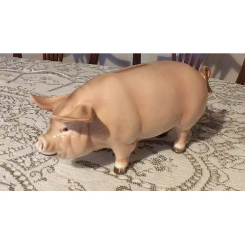 28 - Large, pottery, pig, money box, signed.