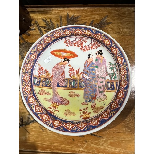 60 - Oriental  platter with six figure mark, paintress signed.