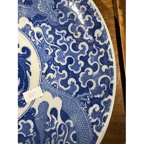 61 - Oriental blue and white platter with bird decoration and blue circular rings under base