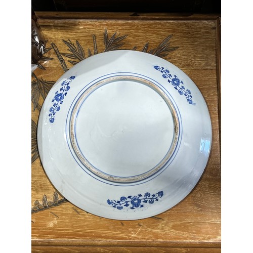 61 - Oriental blue and white platter with bird decoration and blue circular rings under base