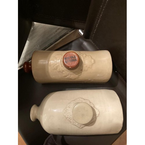 151 - 2 old ceramic hot water bottles. Langley and West Bros.