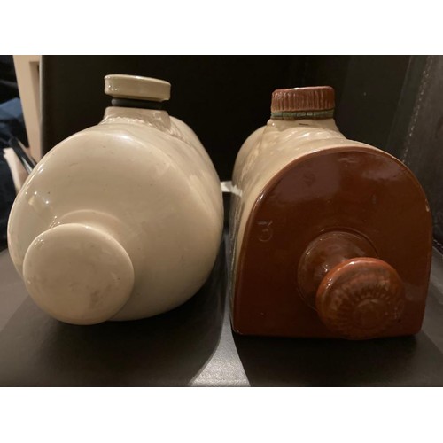 151 - 2 old ceramic hot water bottles. Langley and West Bros.