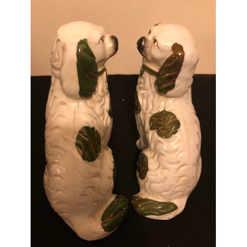 205 - Pair of Staffordshire Spaniel Dogs with a green lustre.