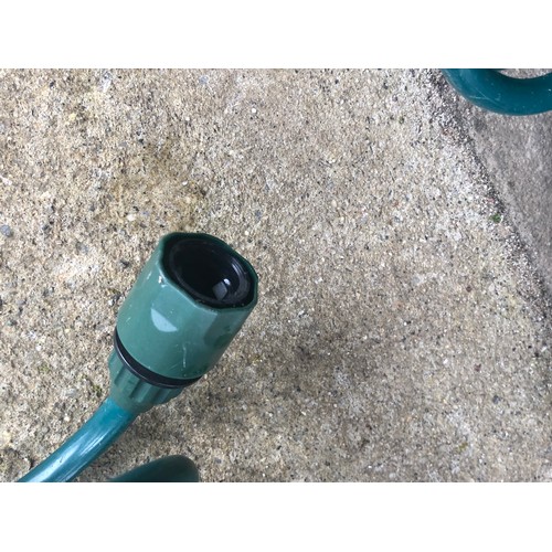 194 - coiled garden hose pipe with quick fit ends