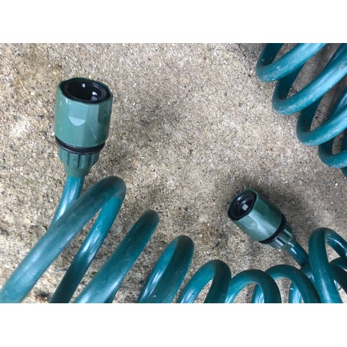 194 - coiled garden hose pipe with quick fit ends