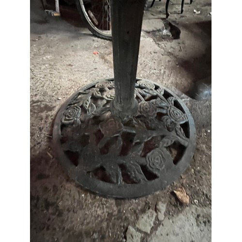 198 - Orange garden parasol. Wind up with heavy cast iron stand.