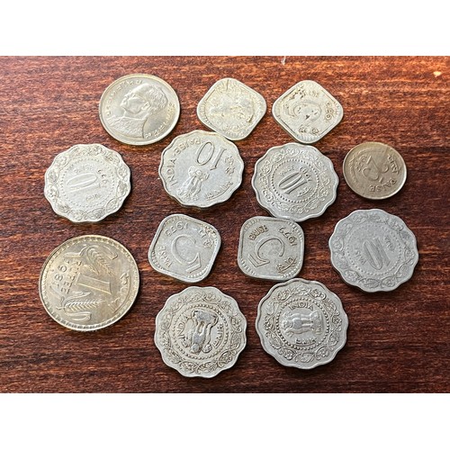 447 - Collection of 13 Indian coins various dates,