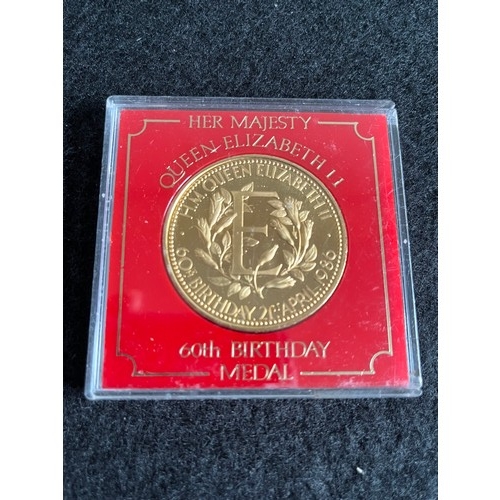 472 - Queen Elizabeth II 60th birthday medal uncirculated in plastic case,