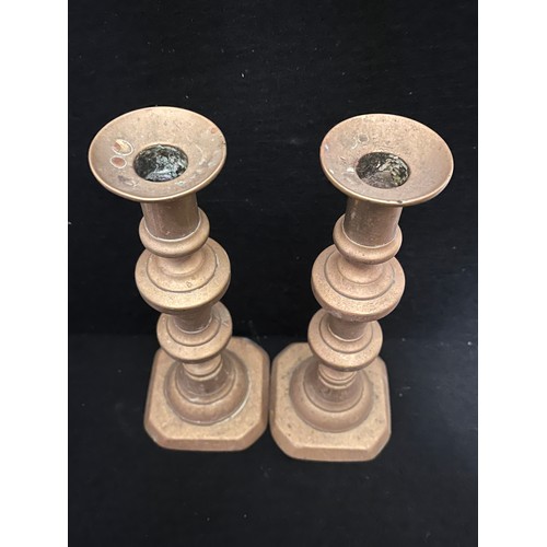 540 - Pair of old brass candlesticks.