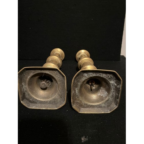 540 - Pair of old brass candlesticks.