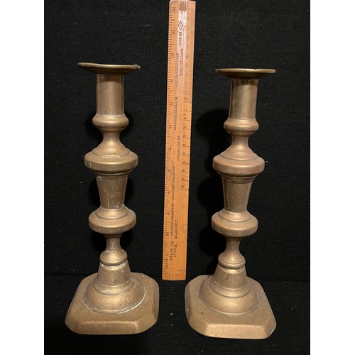 540 - Pair of old brass candlesticks.