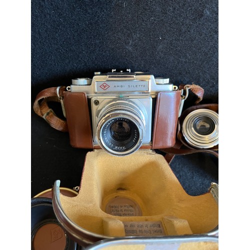 571 - Agfa camera with two spare lenses and filter plus accessories In leather holders.