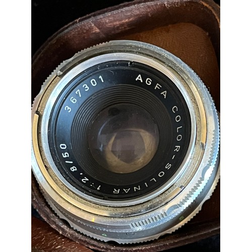 571 - Agfa camera with two spare lenses and filter plus accessories In leather holders.