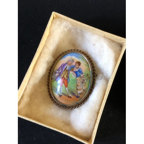 42 - Pretty Limoges France convex hand painted porcelain brooch set in a ropework gold plated frame with ... 